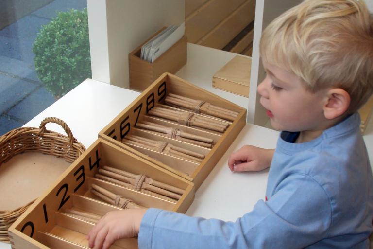 Boy using spindle boxes