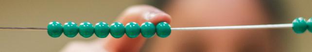 Child using Montessori bead frame material